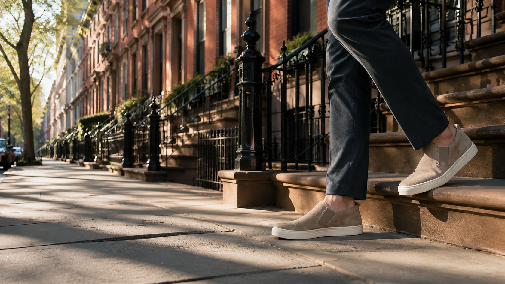 Climbing the steps of a brownstone home